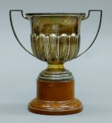 A twin-handled silver trophy cup on stand. 13 cm high overall. 104 grammes of silver.