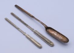 A Georgian silver marrow scoop and two plated examples. Georgian scoop 21.5 cm long.