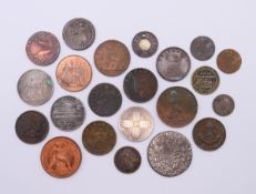 A collection of various coins and tokens to include a Victorian silver florin,