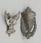 Two vintage brass door knockers, one formed as and eagle, the other a female mask. The latter 19.