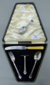 A cased silver Christening set with associated knife,