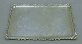 An 800 silver florally engraved tray. 33.5 cm long. 597-4 grammes.