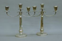 A pair of 800 silver twin-branch candelabras. Each 30 cm high. 1116.8 grammes.