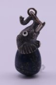 A silver and lapis lazuli elephant egg pendant. 3 cm high excluding suspension loop.
