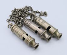 Three vintage whistles to include an ACME CITY whistle,