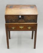 An 18th century oak bible box on stand. 61.5 cm wide x 86 cm high.