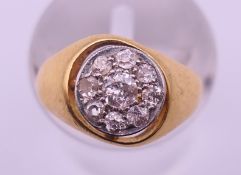 An 18 K gold and diamond ring. Ring size F. 3 grammes total weight.