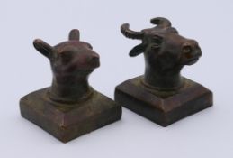 Two Chinese bronze animal head seals. Each 3 cm wide.