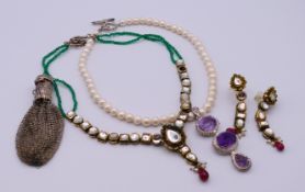 A small quantity of jewellery to include an Indian style necklace with Taneez toggle with matching
