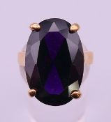 A yellow metal and large single stone dress ring. Stone 2 cm high, ring size N.