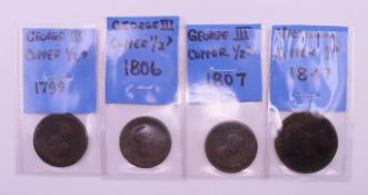Four British coins to include: three George III copper half-pennies (1799,