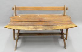 A wooden garden bench and a wooden garden table. The former 150 cm wide.