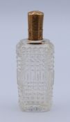 An 18 ct gold-topped scent bottle with stopper. 8.8 cm high.