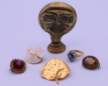 A quantity of costume jewellery to include three brooches, a ring,
