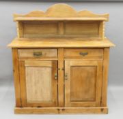 A Victorian satin walnut sideboard. 133 cm wide.