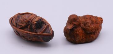 Two wooden carvings, the duck .5 cm long.