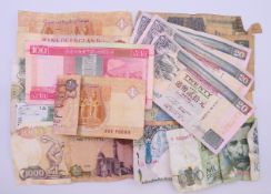A collection of banknotes to include a Bank of England 10 shilling note, a £1 note,