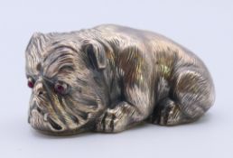A silver model of a dog, bearing Russian marks. 6.5 cm long.