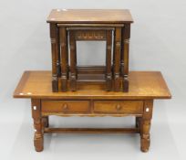An oak nest of tables and an oak coffee table. The latter 114 cm long x 50 cm high.