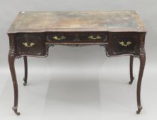 A Victorian mahogany writing table. 106 cm wide.