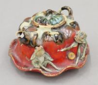 A Chinese Yixing teapot decorated with frogs. 13 cm long.