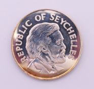 A Republic of Seychelles Queen Elizabeth II Silver Jubilee 25 Rupee proof coin. boxed.