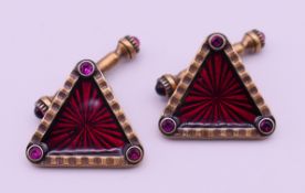 A pair of silver gilt triangular cufflinks, bearing Russian marks. 2 cm high.