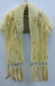 A fur stole. Length 190 cm.