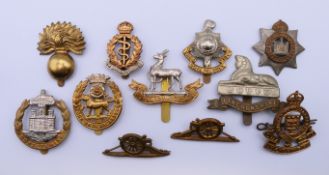 Ten World War I and World War II cap badges. Lincolnshire badge 6 cm wide.