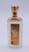 A cased 18 ct gold and glass scent bottle. The case 9.5 cm high.