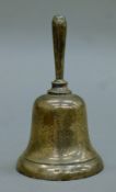 A silver hand bell. 11.5 cm high. 80 grammes.