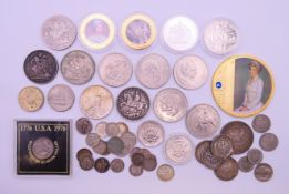 A collection of various silver and other coins to include a George V 1935 crown,