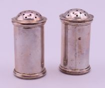 A pair of Hamilton & Co Calcutta silver peppers. 5.5 cm high. 71.5 grammes.