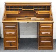 An early 20th century oak roll top desk. 126 cm wide.