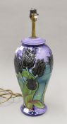 A Moorcroft black tulip design table lamp. 43 cm high overall.