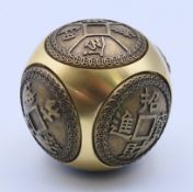 A Chinese brass meditation spinning ball. 5 cm diameter.