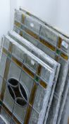 A quantity of early 20th century leaded stained glass panels. The larger panels 58 x 46 cm.