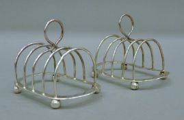Two silver toast racks. Each 11 cm long. 146.2 grammes.