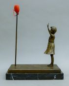 After Banksy, bronze of the Balloon girl mounted on a marble plinth base. 28 cm long.