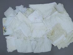 A quantity of vintage crocheted tablecloths and other linens.
