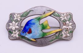 A sterling silver brooch with enamelled fish and lilies by Caron Bros of Montreal. 6.25 cm wide.