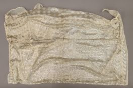 A 1920's Egyptian shawl, threaded with unmarked white metal. Approximately 210 cm long.