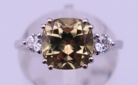 A platinum and turkizite ring. Ring size K/L. 5.2 grammes total weight.