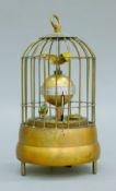 A birdcage clock. 17 cm high.