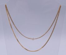 A 9 ct gold chain. 60 cm long. 12.4 grammes.