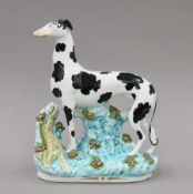 A Victorian Staffordshire porcelain standing Disraeli coursing greyhound. 27.5 cm high.