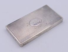 A silver stamp case with gilt interior, the lid engraved 'G.H. Pierry'. 8 x 4 x 0.8 cm.