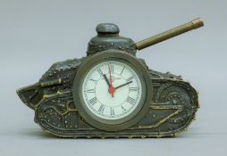 A bronze clock formed as a tank. 16 cm long.
