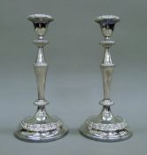 A pair of silver-plated candlesticks. Each 26 cm high.