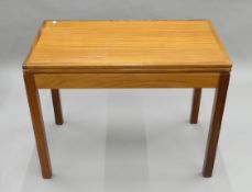 A mid-century folding card table. 91.5 cm wide.